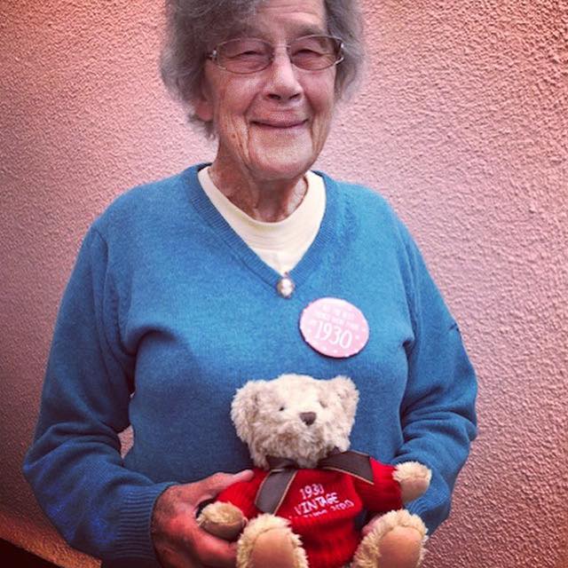 90 year old lady holding a bear
