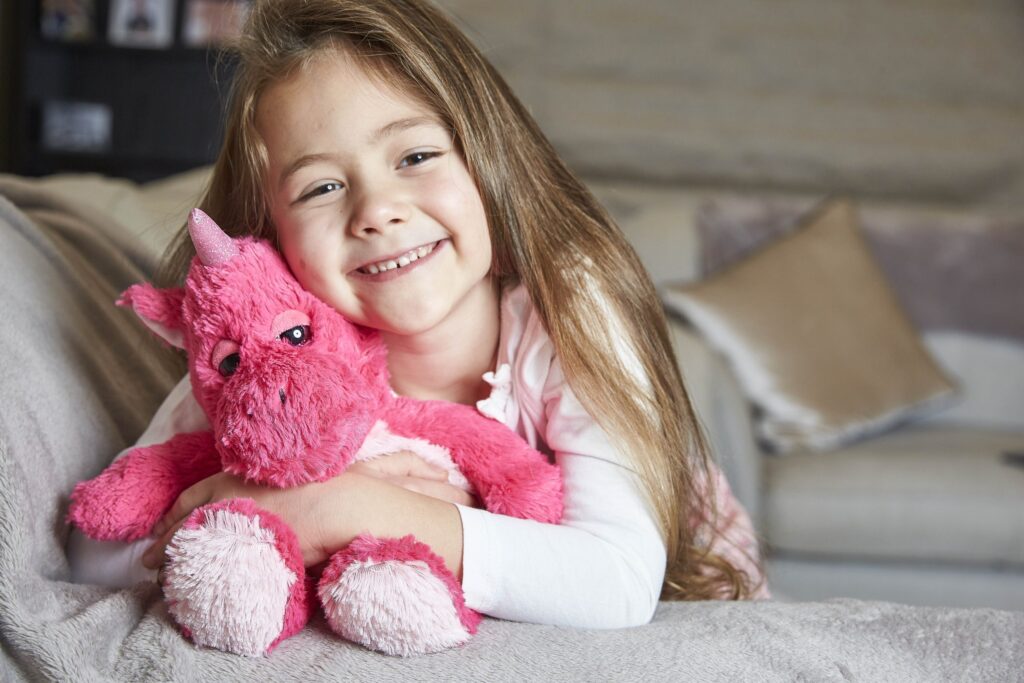girl with warmies unicorn